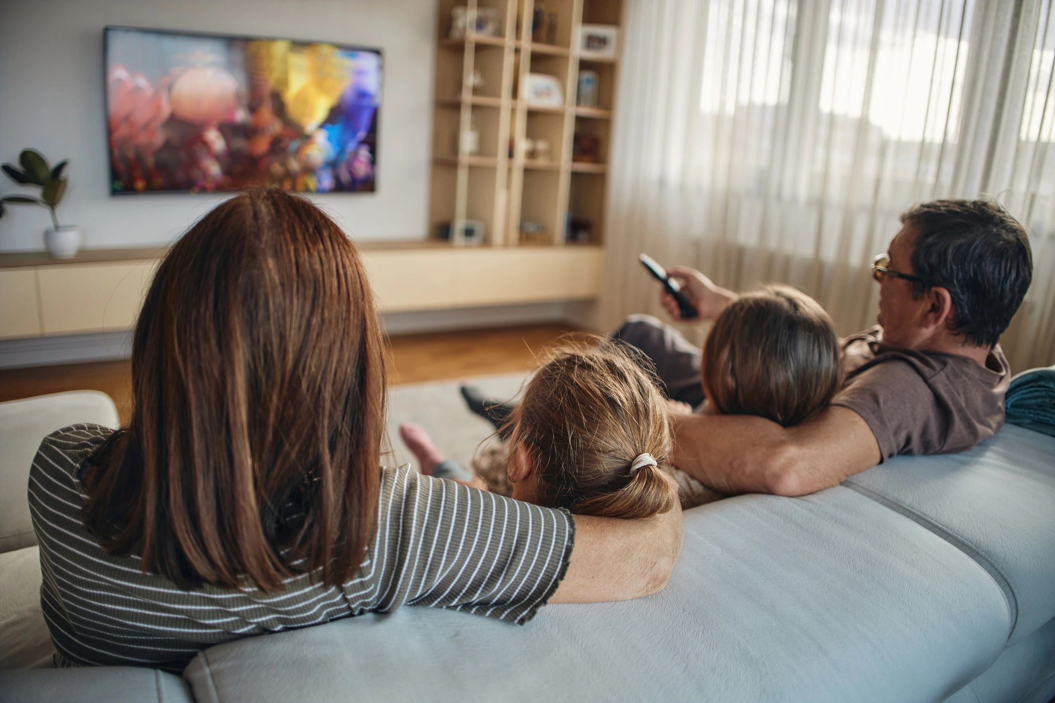 Multi-generation family watching TV